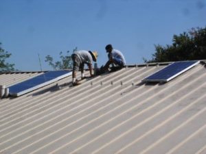 working on metal roof plus solar